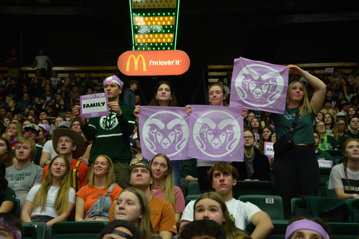 Colorado State University students hold up purple Ram bandanas in support of the Fight Like a Ram womens basketball game Jan. 27. CSU beat San Jose State University 65-49.