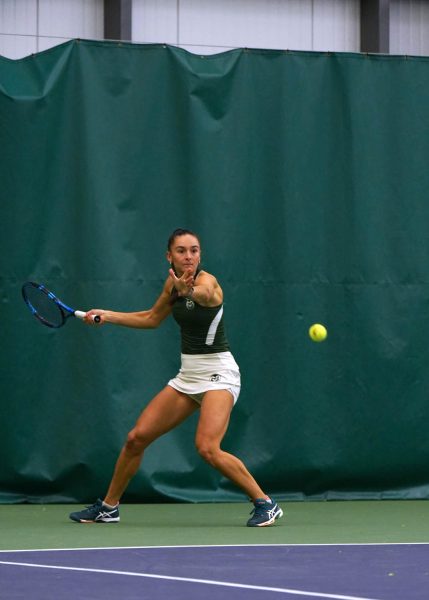 Radka Buzkova hits the ball back to Abilene in her singles match Jan 26.