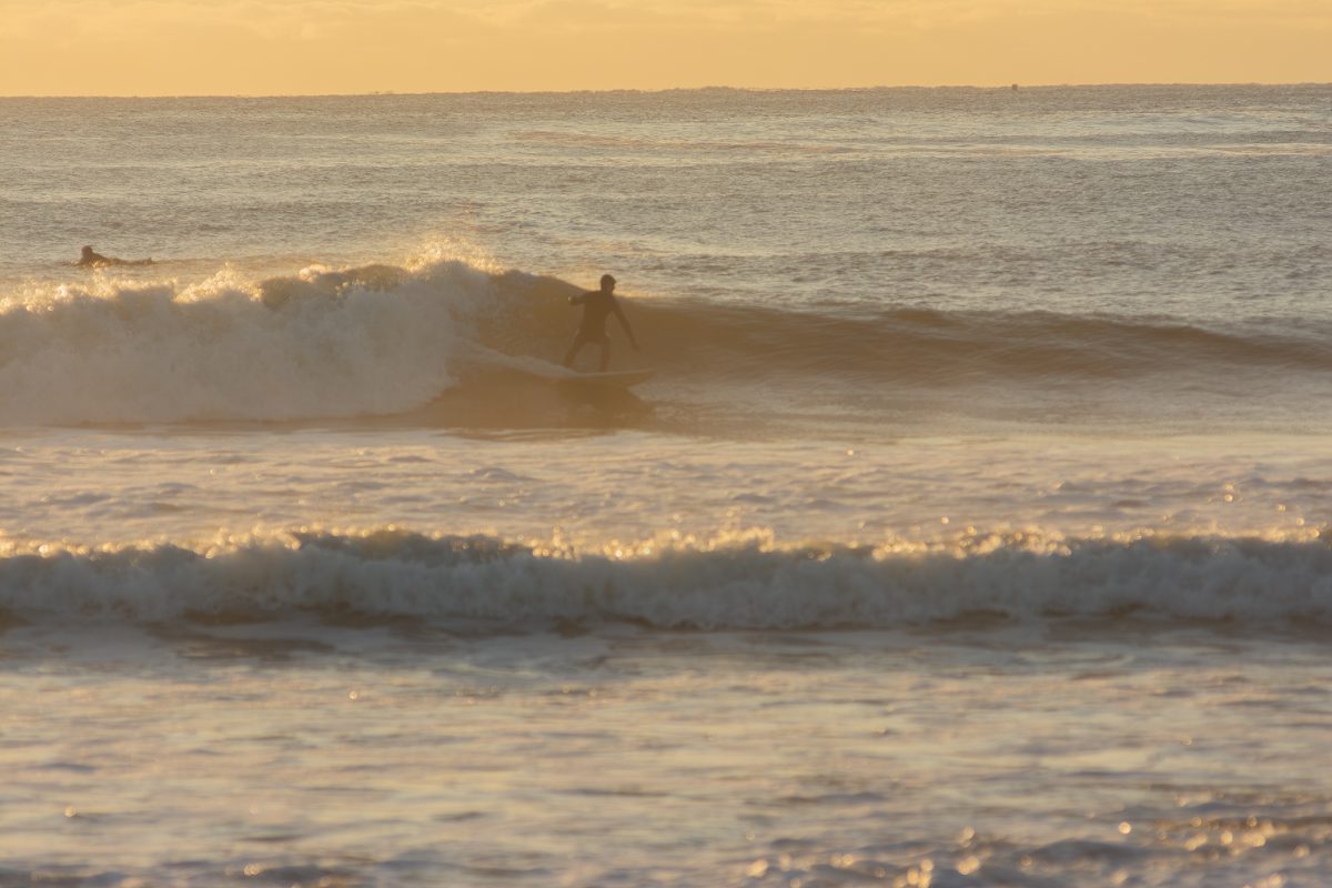 A surfer catches a nice wave during their surf session at Bass Beach in Rye, New Hampshire. (Dec 20,2023)
 