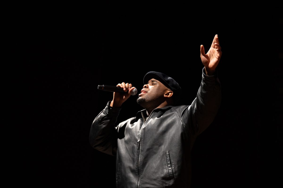 Artist E.M.E. performs a song he wrote called 'God Got Me' to the audience of the annual celebration of Martin Luther King Jr. Day.