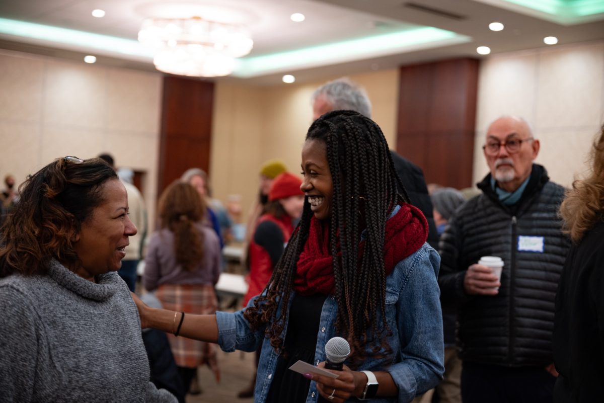 BIPOC Alliance core team member Rashida Perez connects with Homeward Alliance Grants Coordinator Tara Hunter at the Day of Service for Martin Luther King Jr. Day.