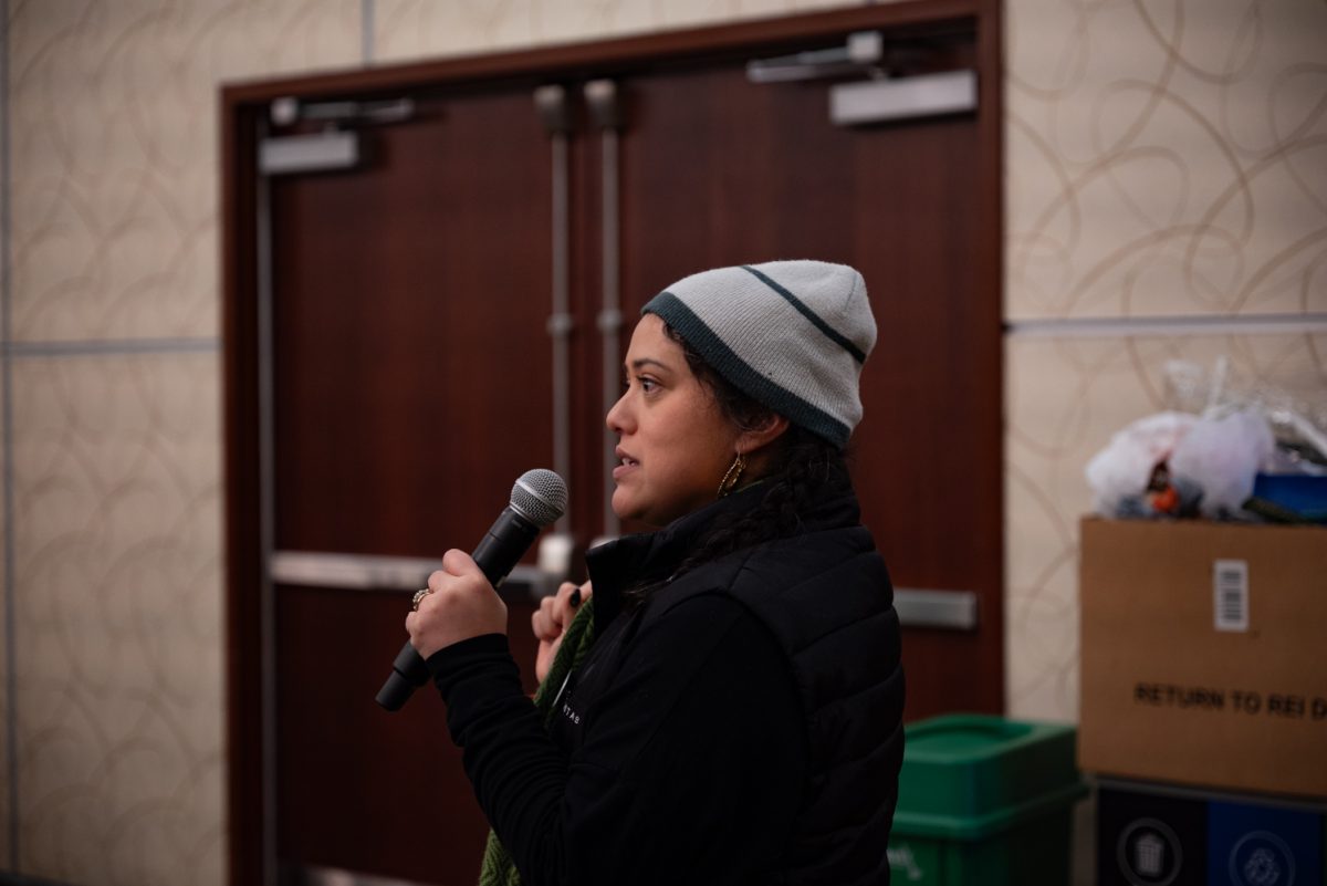 BIPOC Alliance Program Director Jamie Rasmussen asks for volunteers to help load donated clothes to be transported at the Day of Service for Martin Luther King Jr. Day.