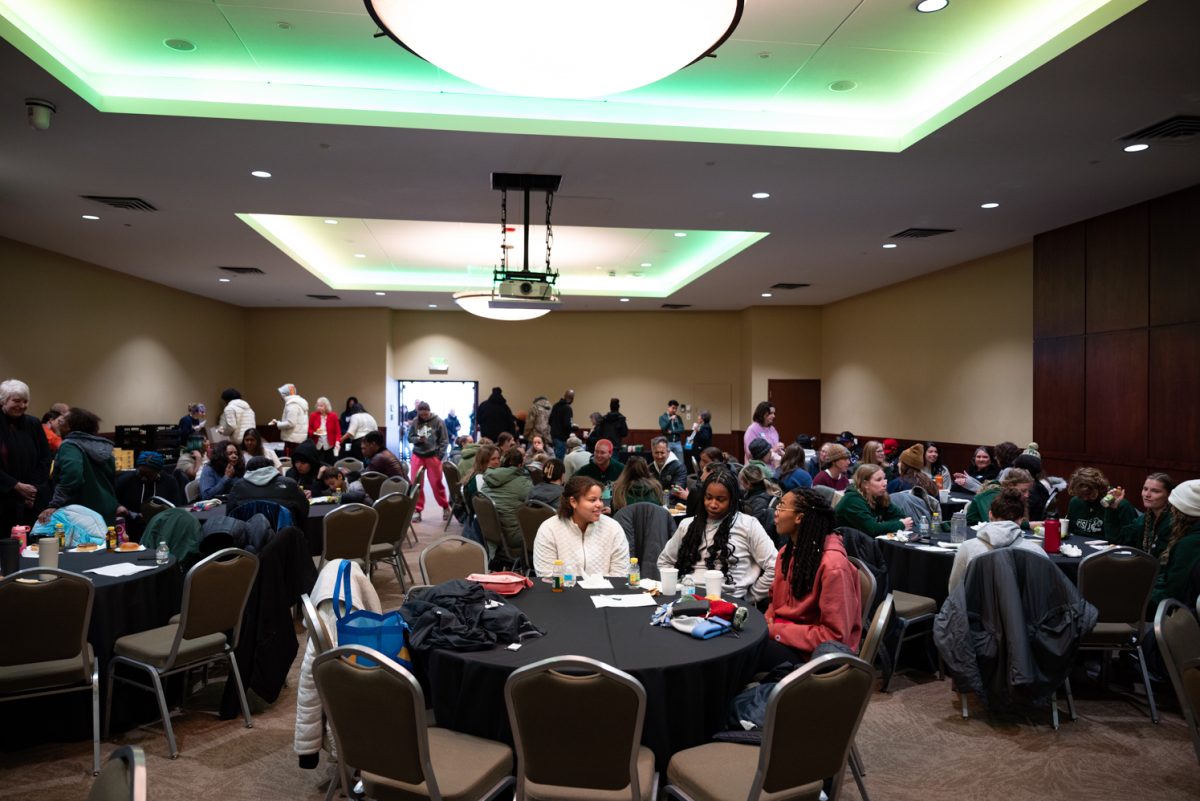 People gather to mingle and enjoy breakfast in the Lincoln Center as part of a celebrating Martin Luther King Jr. Day.