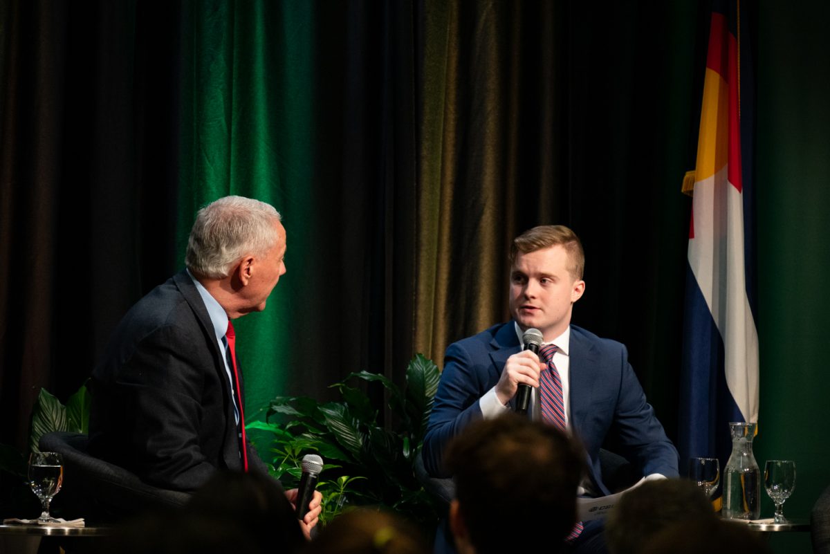 Student moderator Jack Barrett asks a follow-up question at the Coffee with Ken Buck event in the University Ballroom.