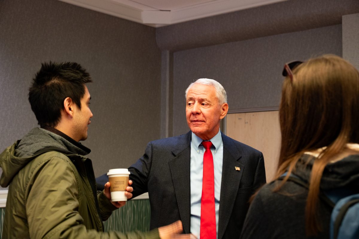 Representative Ken Buck speaks to members of the audience after the Coffee with Ken Buck event in the University Ballroom.
