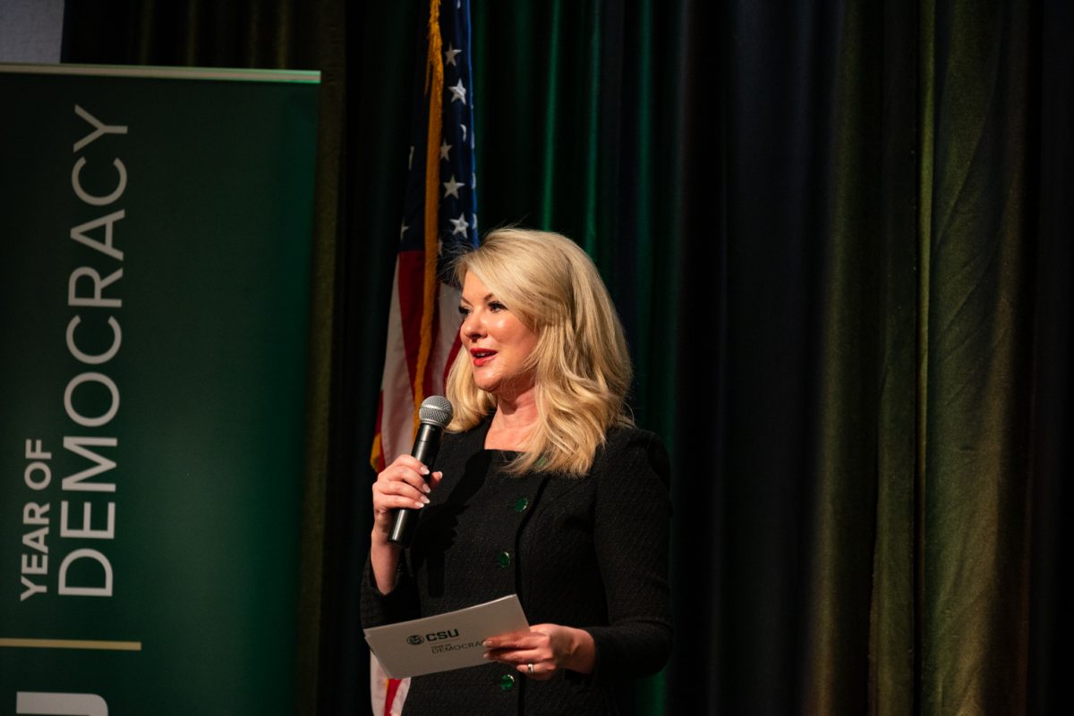 Colorado State University President Amy Parsons introduces the student speakers and Representative Ken Buck to the stage of the University Ballroom in the Lory Student Center.
