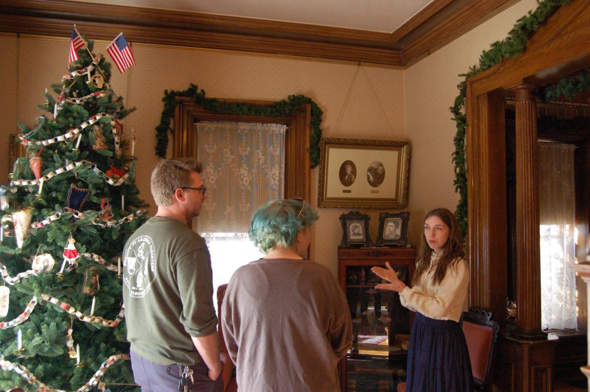Avery House docent Grace Poat gives a tour to Fort Collins residents Dec. 2, 2023. Poat has been volunteering with the Avery House since October and enjoys explaining the history of the house to guests. The Avery House, located on Mountain Avenue, was constructed in 1879 and now serves as a local history museum. The building was placed on the National Register of Historic Places in 1972.