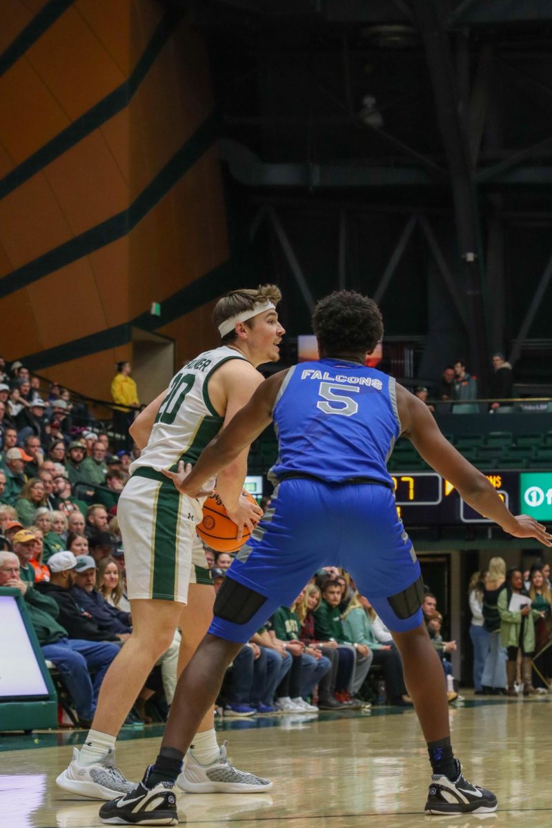 Colorado State University No. 20, Joe Palmer looks for a teammate to pass to in the basketball game against the Air Force Academy on January 16th, 2024. CSU won in overtime 78-69.