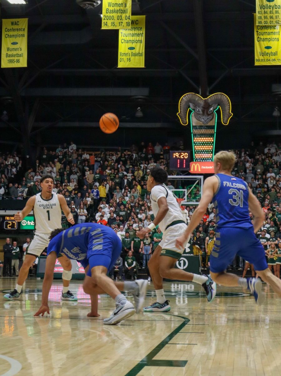 Josiah Strong (3) passes the ball to Joel Scott (1) in the Colorado State University basketball game against the U.S. Air Force Academy Jan. 16. CSU won in overtime 78-69.
