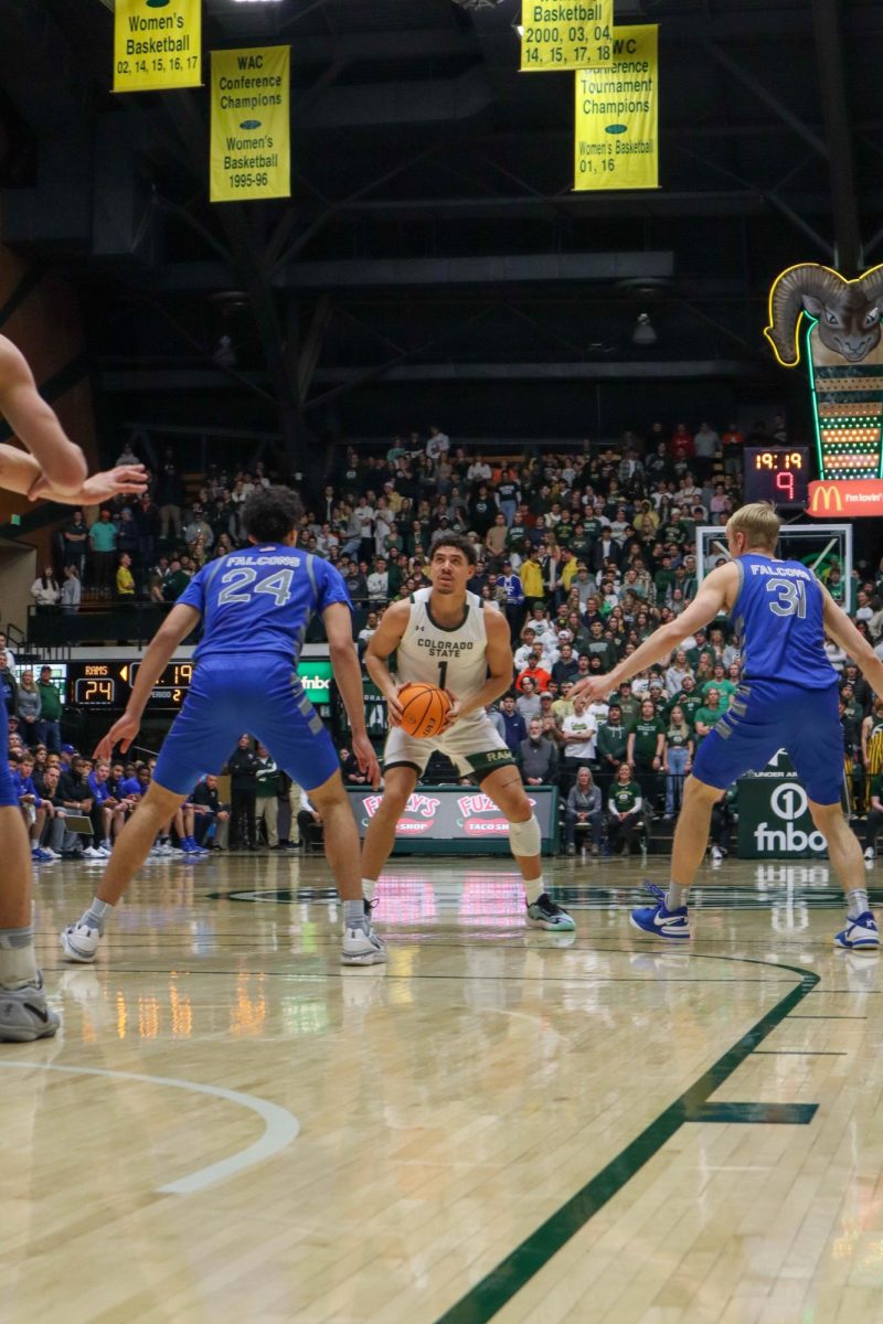 No. 1 Joel Scott looks to shoot the ball in the basketball game against the Air Force Academy, CSU won in overtime 78-69.