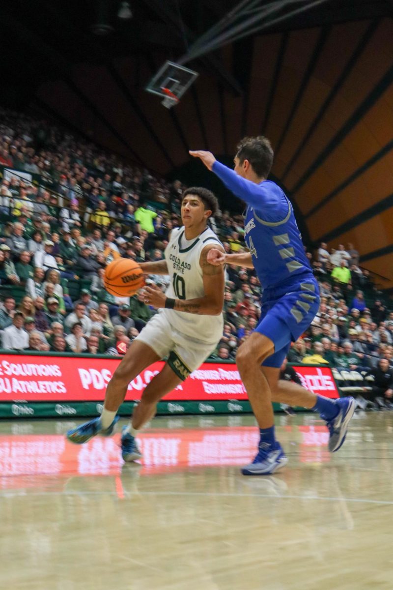 Nique Clifford (10) dribbles the ball down the court in the Colorado State University basketball game against the U.S. Air Force Academy Jan. 16. CSU won in overtime 78-69.