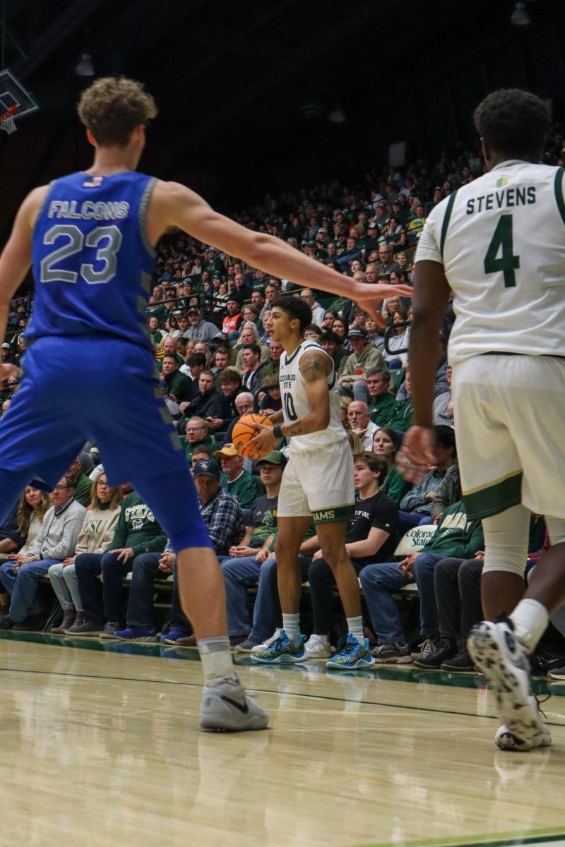 Nique Clifford (10) looks to pass the ball to a teammate in a Colorado State University men's basketball game against the U.S. Air Force Academy Jan. 16. CSU won in overtime 78-69.