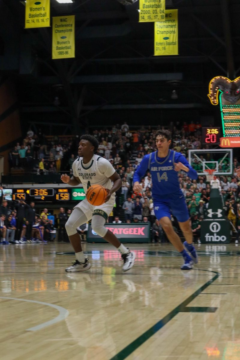 Colorado State University guard Isaiah Stevens (4) works around U.S. Air Force Academy defense Jan. 16. CSU won in overtime 78-69.