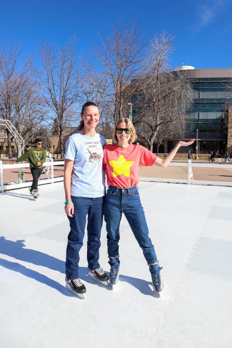 Colorado State University senior Heide Keeble and masters student Liana McIsaac pose for the camera mid-skate at the Residence Hall Association's "Rams on Ice" event.  "I feel really happy because I've been wanting to ice skate and I haven't been able to do so," McIsaac said. Jan.31.