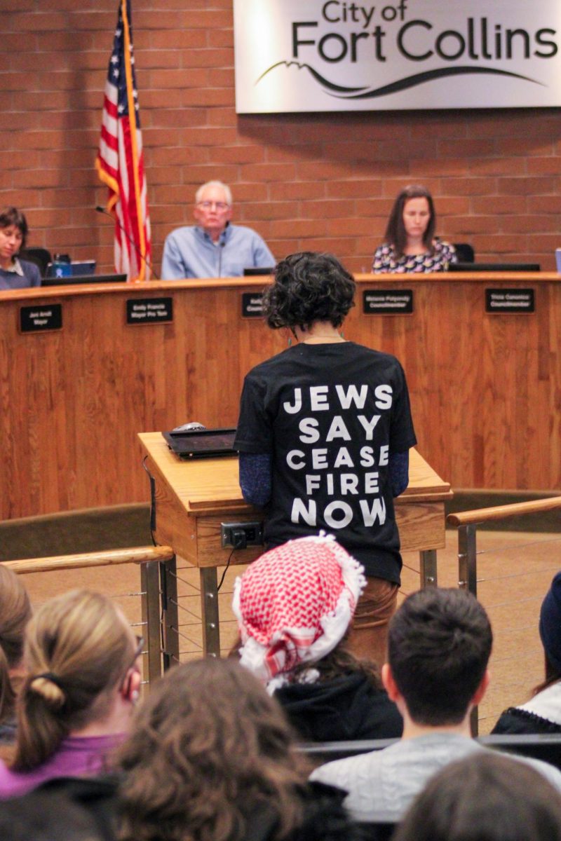 A Fort Collins community member addresses city council with a shirt reading Jews say cease fire now.
