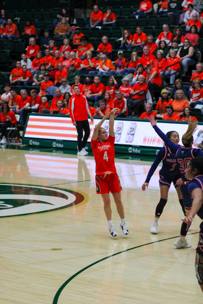 MaKenna Hofschild (4), a Colorado State point guard, shoots a three point shot against Fresno State.