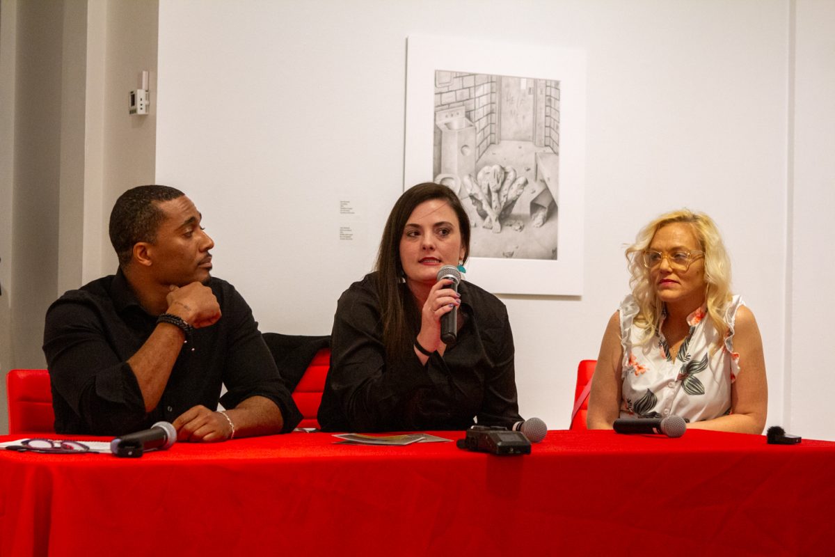 Ashley+Hamilton+speaks+about+her+experience+in+incarceration+while+other+artists+Sean+Marshall+and+Shawna+Hockaday+listen+at+the+To+See+Inside%3A+Art%2C+Architecture+and+Incarceration+panel+discussion+at+the+Museum+of+Art+Fort+Collins+Feb.+8.