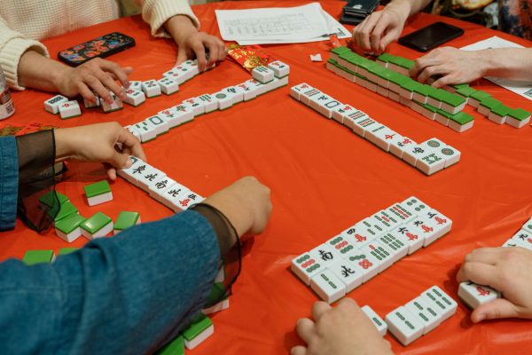 Students finish a game of mahjong during the Colorado State University Asian Pacific American Cultural Center Lunar New Year Celebration for 2024s Year of the Dragon Feb. 9. Mahjong was invented in 19th century in China and is currently played all around the world with different variations.