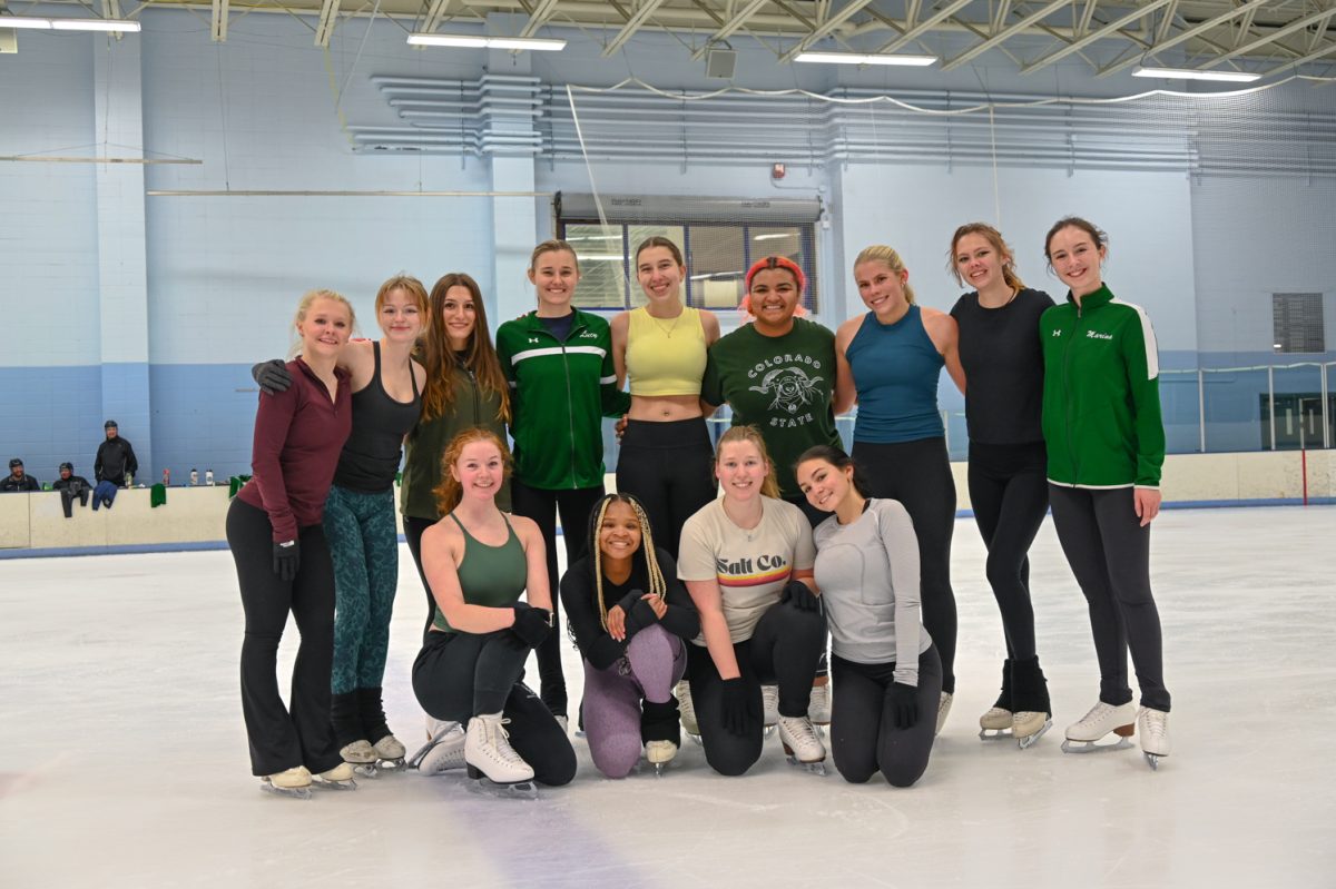 CSUs club figure skating team gathers around for a group photo during their club session at the Edora Pool Ice Center Feb. 10.