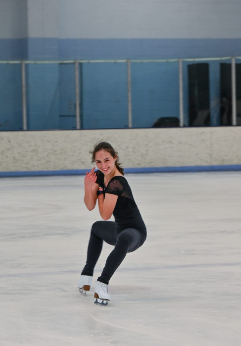 A figure skater practices her routine on the ice during the CSU figure skating club session, Feb 10, 2024