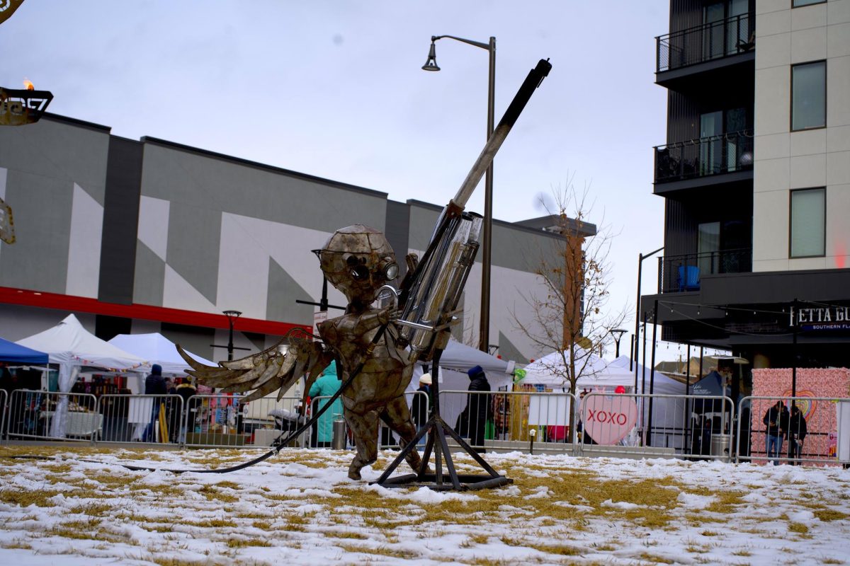 Artwork titled Dark Cupid made by Drew Hsu, also known as Torch Mouth, is displayed in the Foundry Plaza in Loveland, Colorado during the annual Sweetheart Festival Feb. 10.