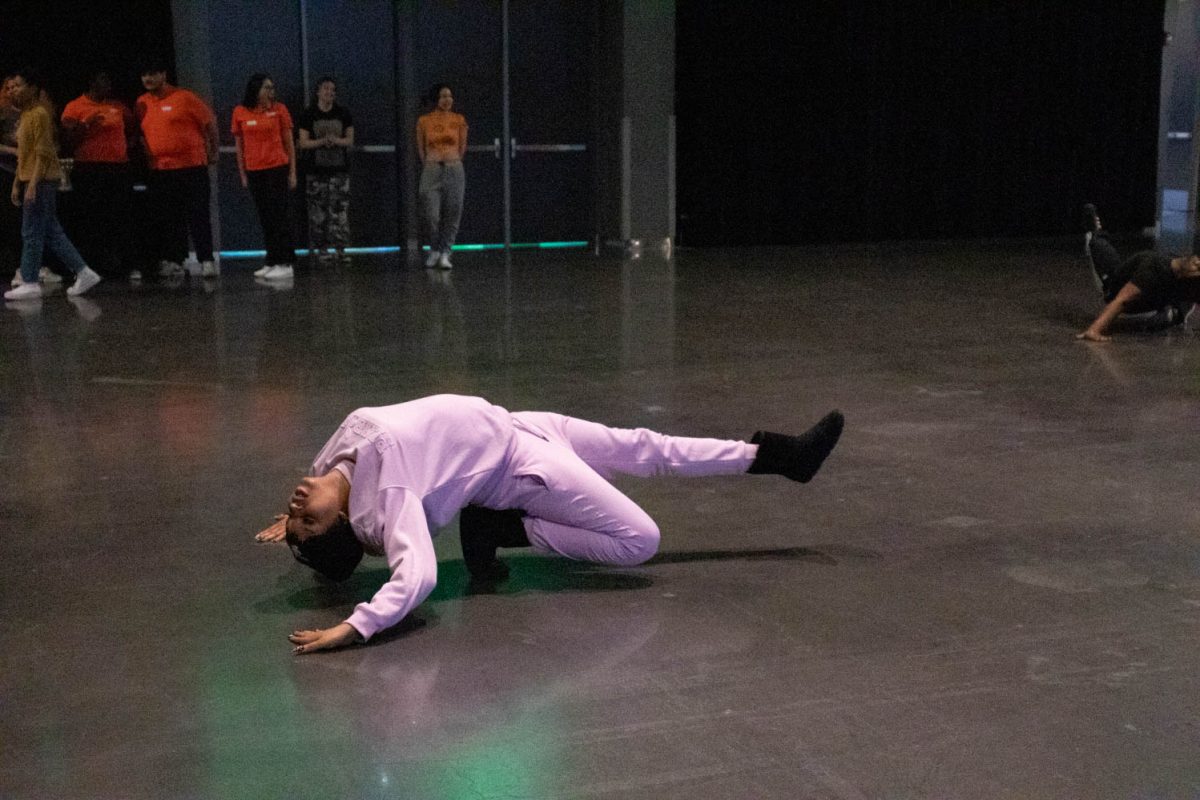 One of the instructors demonstrates how to dip during the Category is Ballroom event on February 15, 2024.