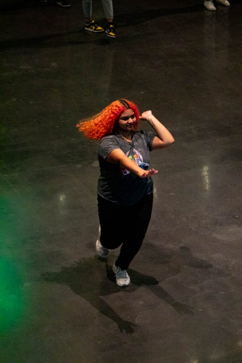 Ava Ayala, a second year zoology student at CSU practices her catwalk during the first day of the Category is Ballroom event on February 15, 2024.