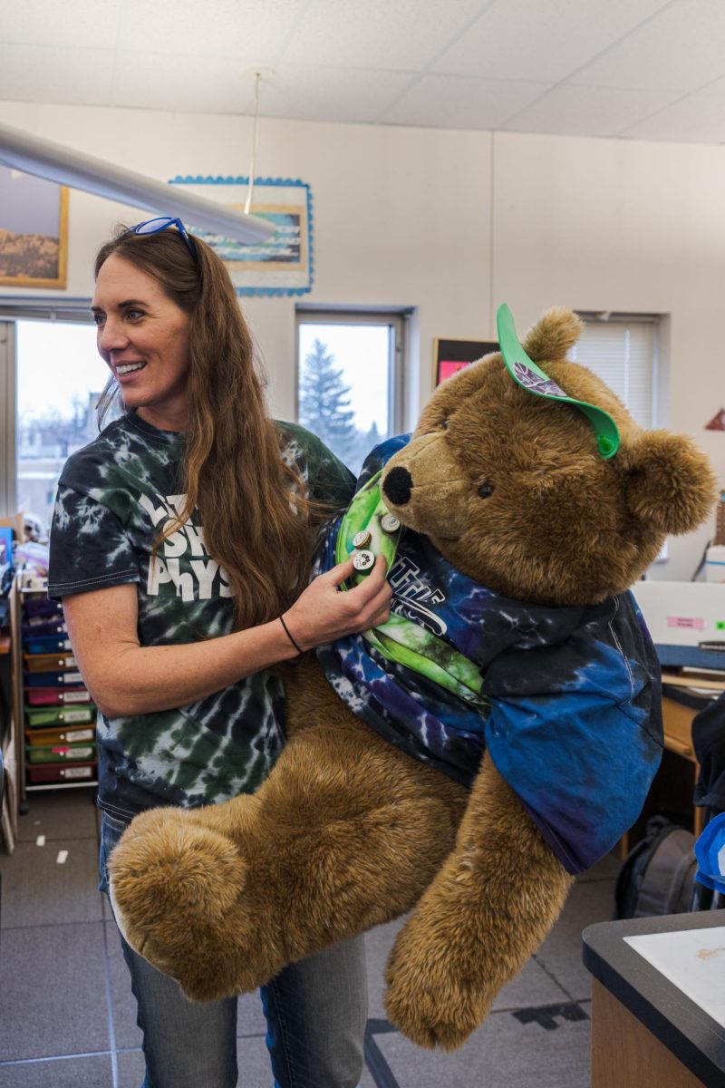 Little Shop of Physics Teacher in Residence Cherie Bornhorst introduces Sir Bearington Feb. 15. Bearington has badges for air sports, watersports, and more based on experiments that he has been a part of.