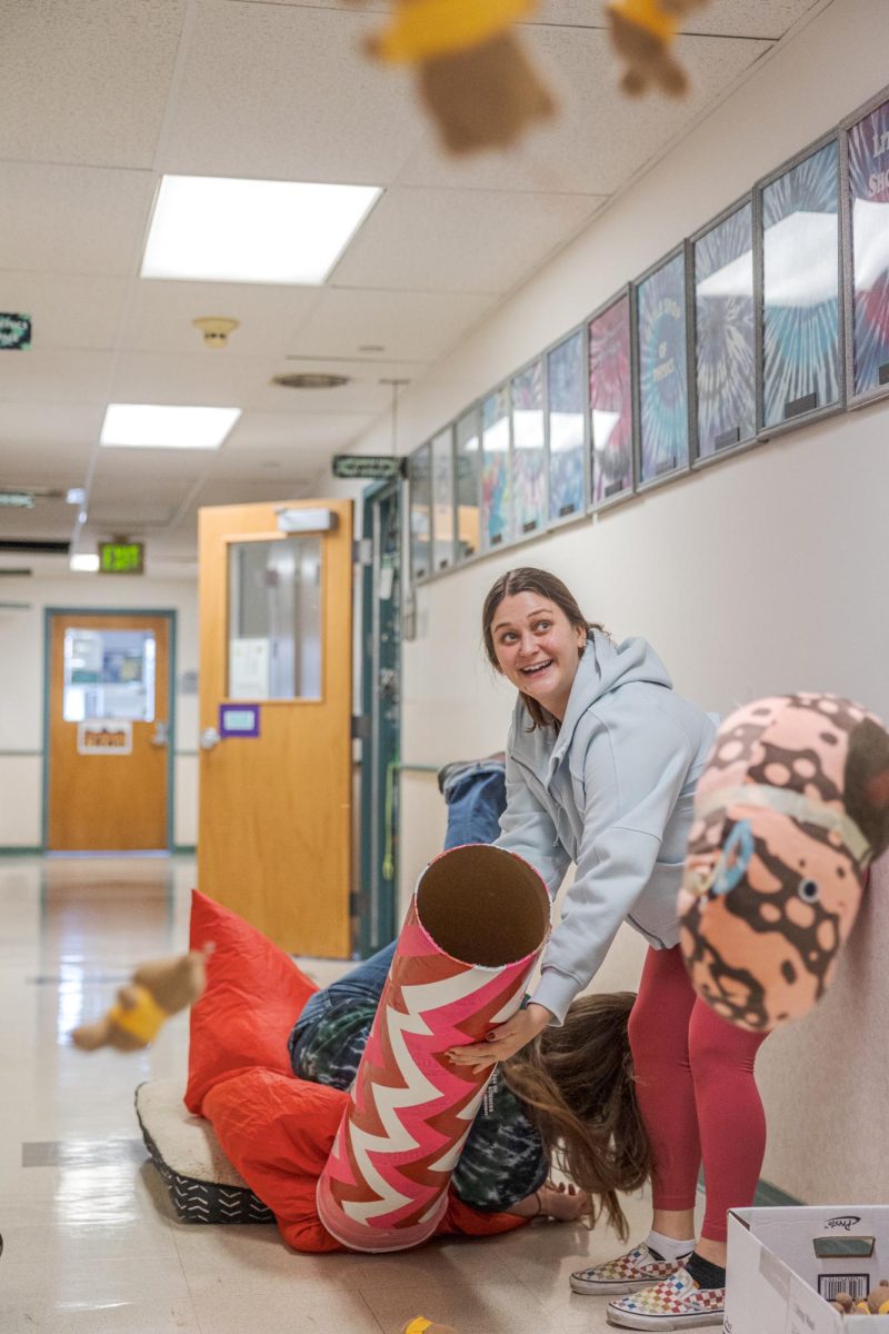 Little Shop of Physics Teacher in Residence Cherie Bornhorst and student intern Grace Balle demonstrate their system for distributing stuffed toys during outreach events Feb. 15.