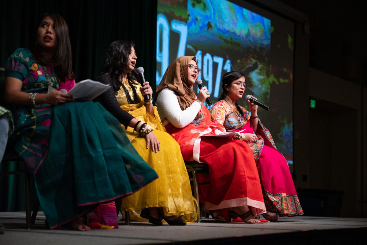Members of the Bangladesh Student Association present information about their culture and language at the World Unity Fair Feb. 17.