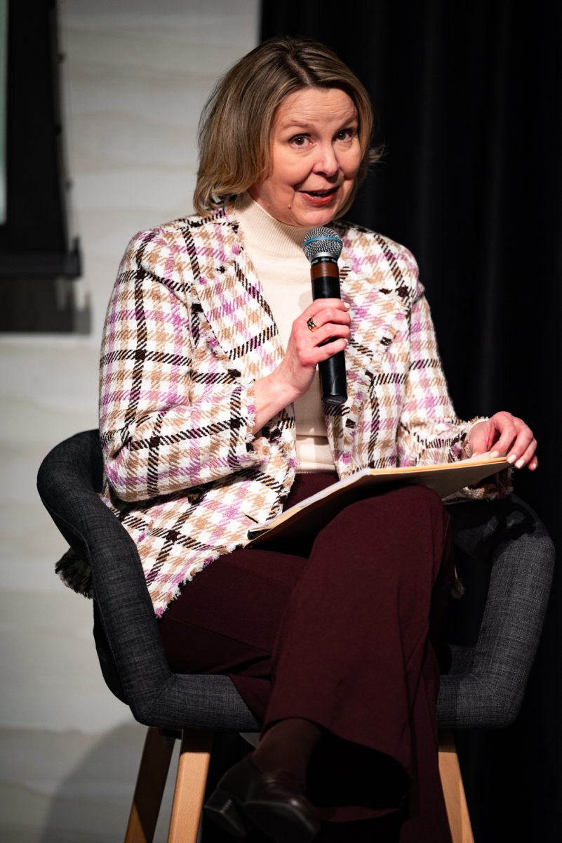 Panel moderator Karrin Anderson, a professor of Communication Studies, introduces each panelist and the topic of debate for a Thematic Year of Democracy discussion.