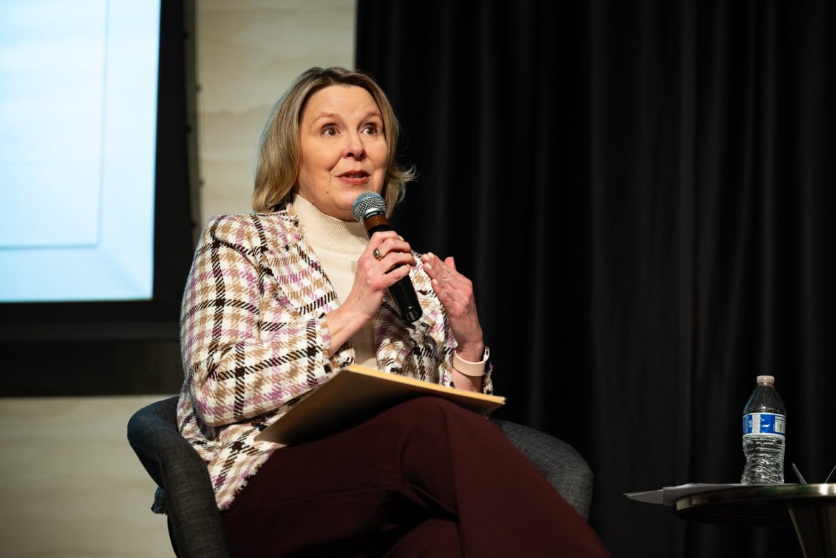 Panel moderator Karrin Anderson, a professor of Communication Studies, opens the floor to audience questions at a Thematic Year of Democracy discussion.