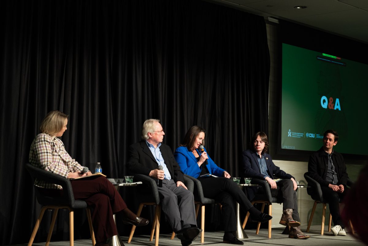 Panelist Christine Fruhauf, a professor of Human Development and Family Studies, answers an audience question at a Thematic Year of Democracy discussion.