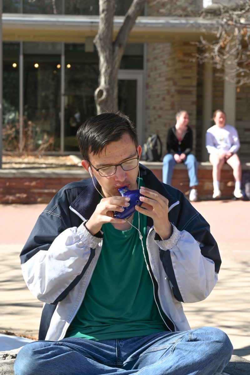 Cameron Turner plays his ocarina in the LSC courtyard on  Feb. 20th, 2024.