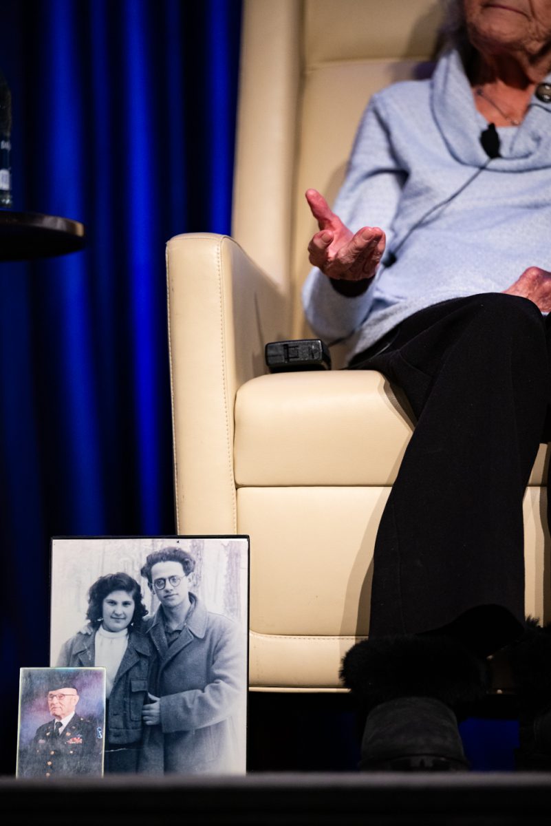 A photo of Holocaust survivor Esther Basch's family sits by her chair at the Evening with a Holocaust Survivor event.