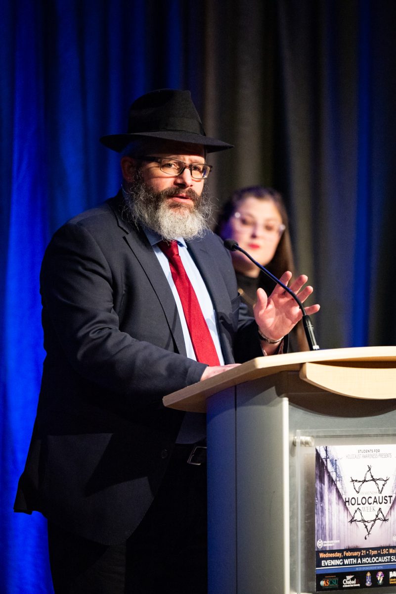 Rabbi Yerachmiel Gorelik, faculty advisor for Students for Holocaust Awareness Week at CSU, thanks Esther Basch for coming to speak at the Evening with a Holocaust Survivor event.