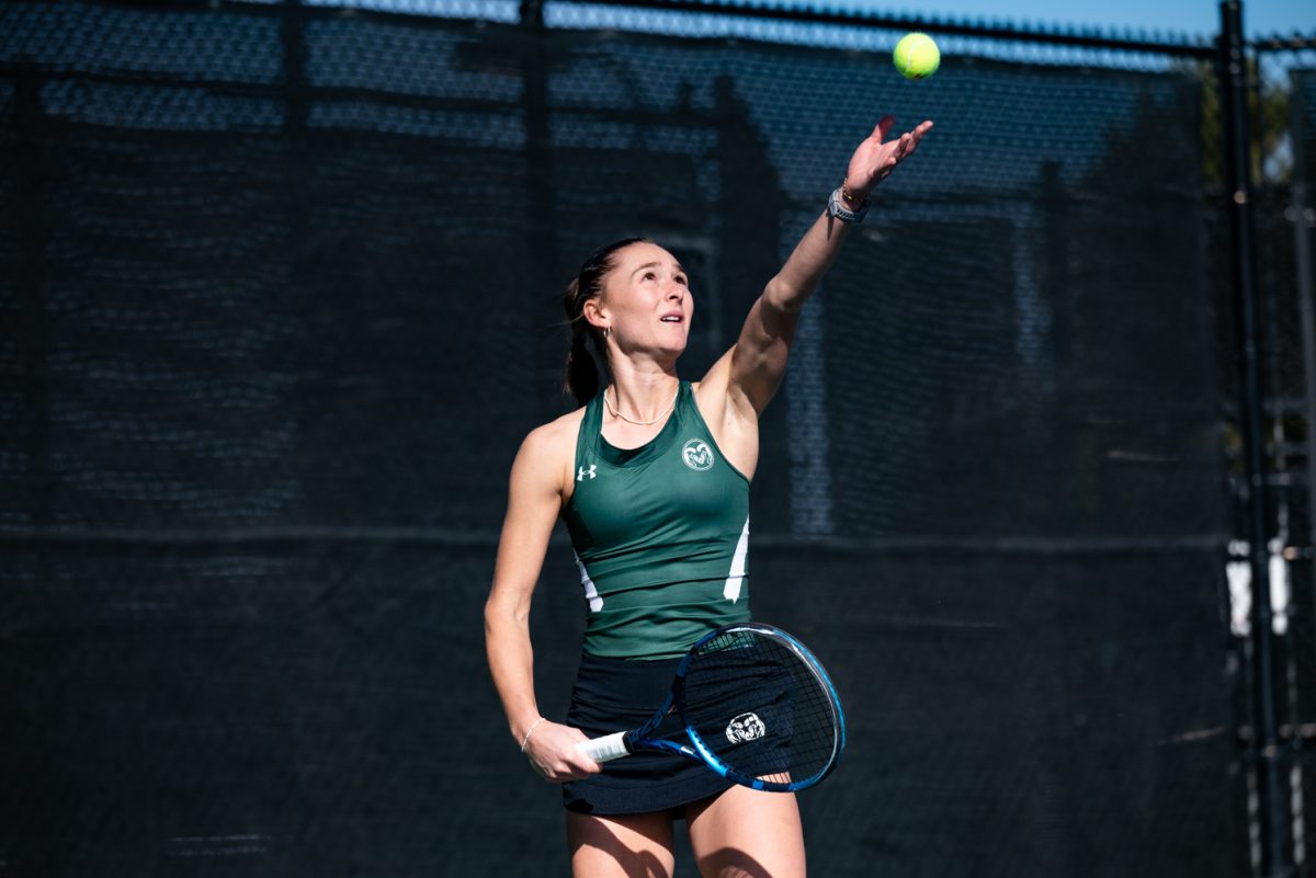 Graduate student Radka Buzkova prepares to serve the ball during a singles match against Northern Arizona University.