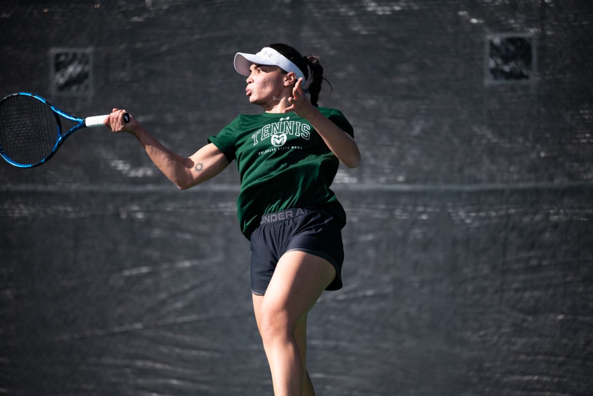 Graduate student Zara Lennon hits the ball during a singles match against Northern Arizona University.