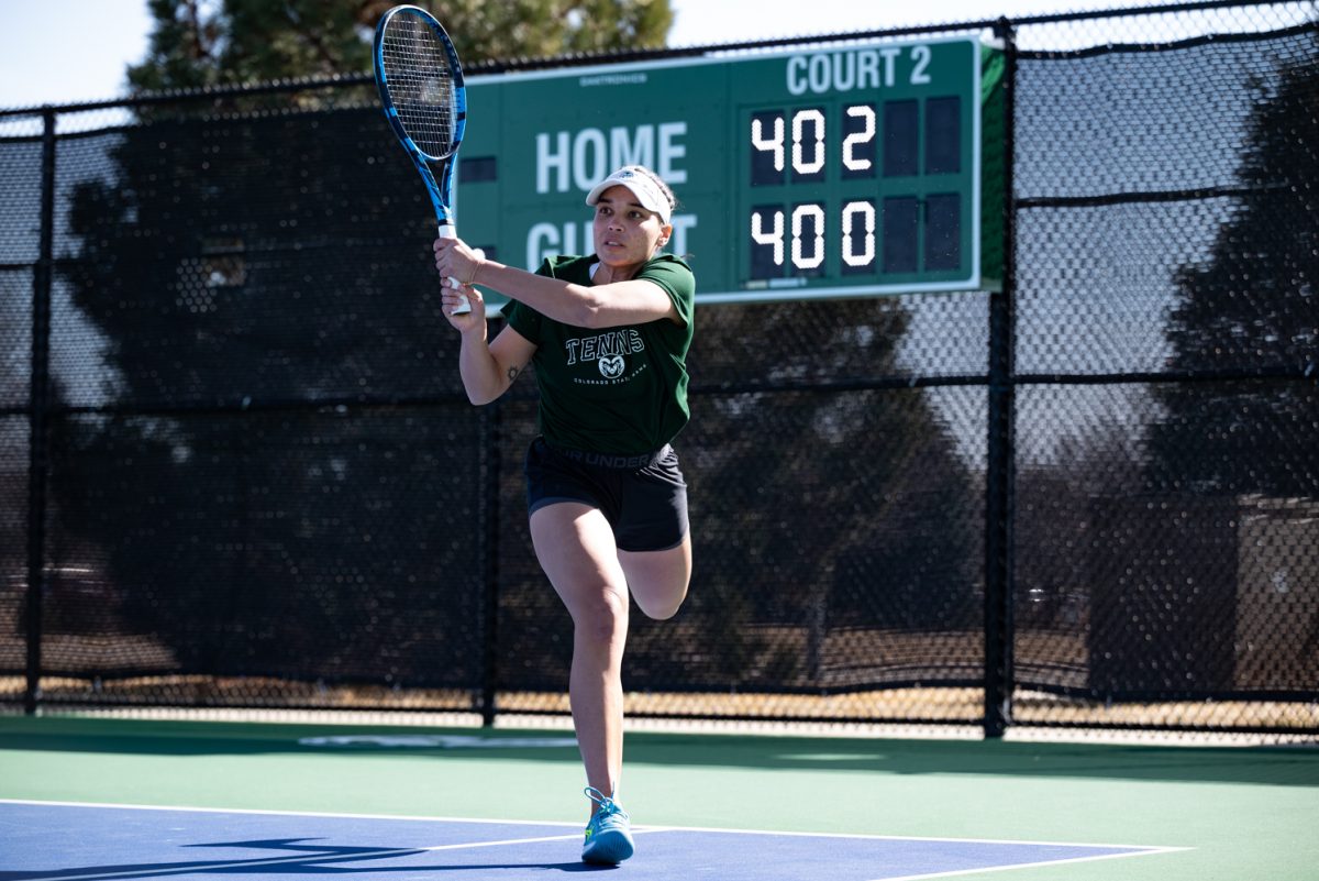 Graduate student Zara Lennon strikes the ball in a doubles match against Northern Arizona University.