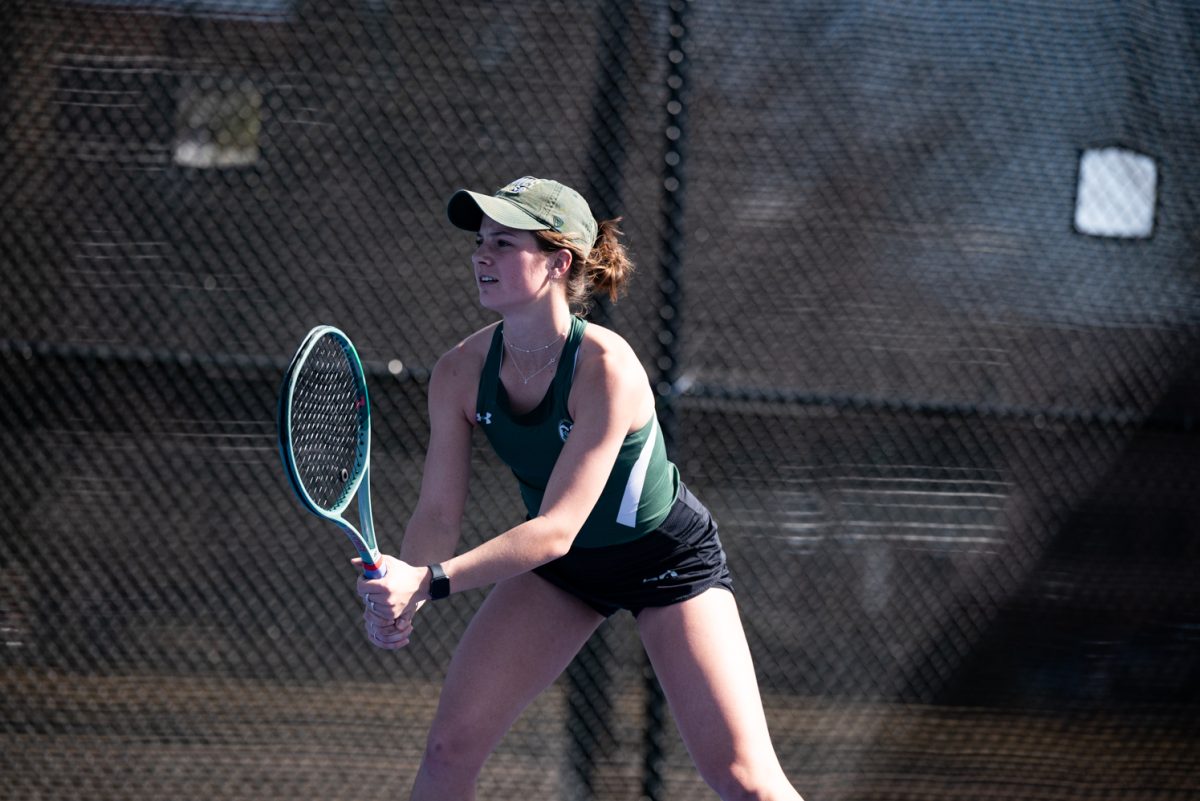 Freshman Logan Voeks gets ready for Northern Arizona University's serve during a doubles tennis match.