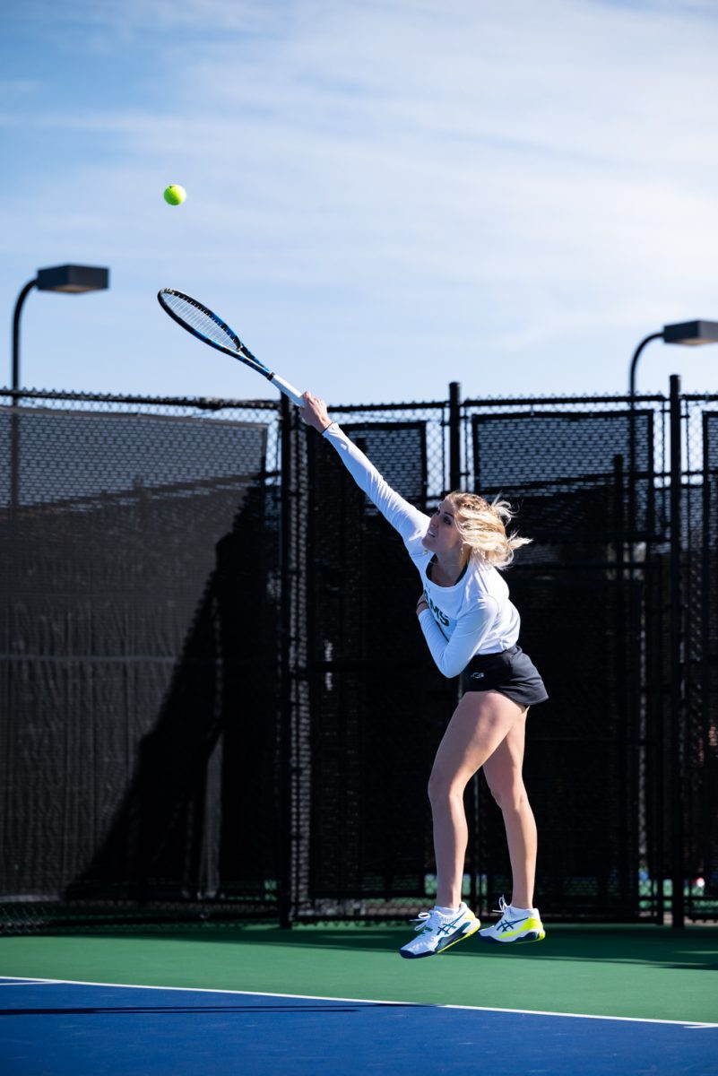Graduate student Sarka Richterova serves the ball during a singles match against Northern Arizona University.