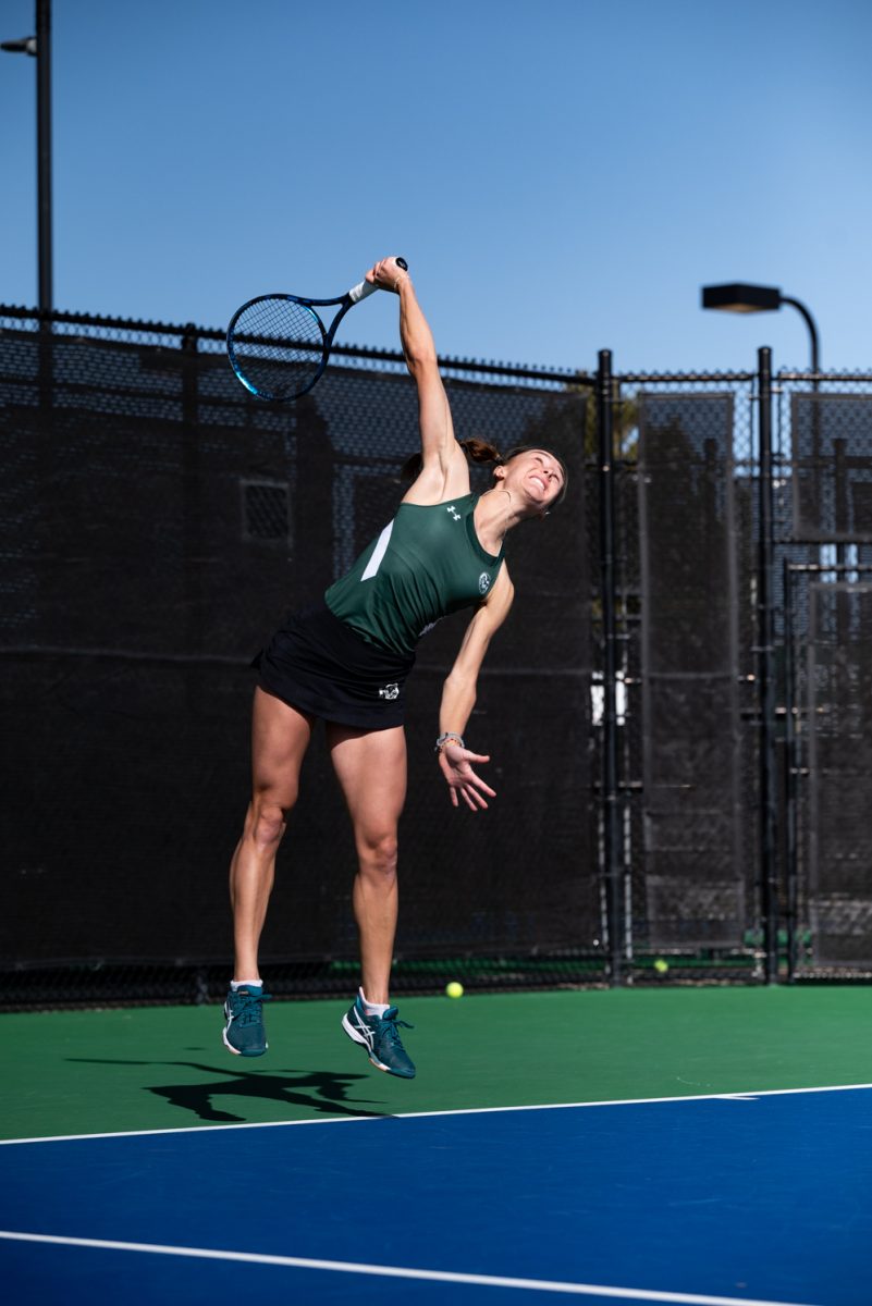 Graduate student Radka Buzkova serves the ball during a singles match against Northern Arizona University.
