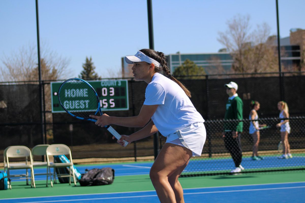 Zara Lennon prepares for her opponents returning hit in Colorado States Womens Tennis Teams game against the University of Colorado Feb. 25.