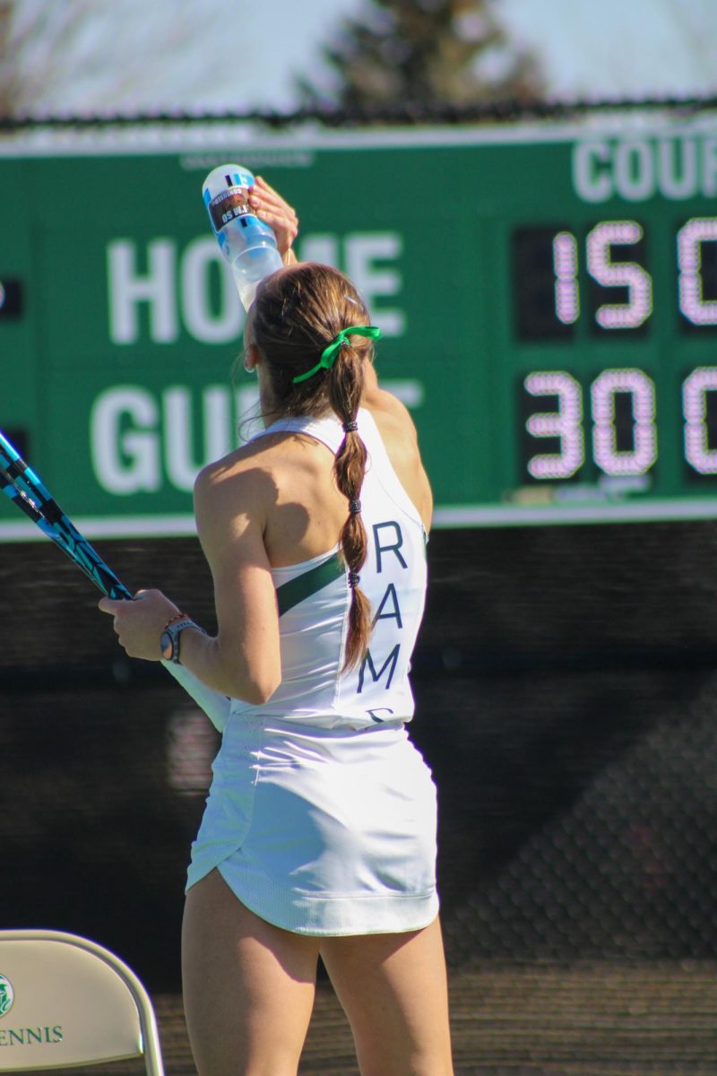Colorado State Womens Tennis player Radka Buskova stays hydrated in between sets Feb. 25.