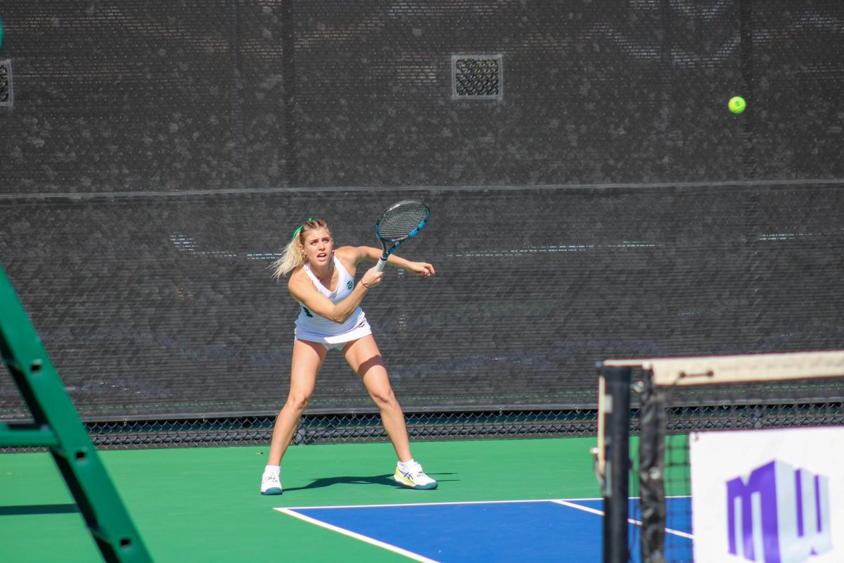 Sarka Richterova hits the ball over the net to her opponent Feb. 25.