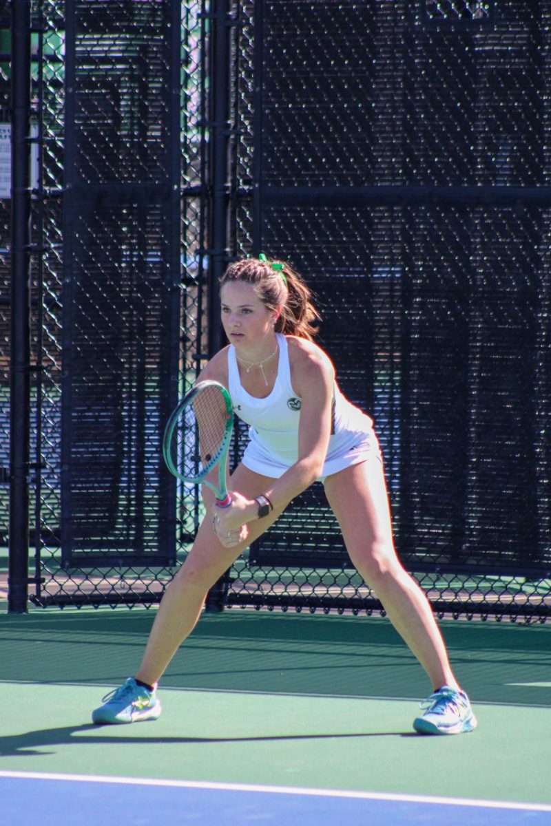 Logan Voeks, a member of the Colorado State womens tennis team, watches carefully as her University of Colorado opponent serves the ball Feb. 25.