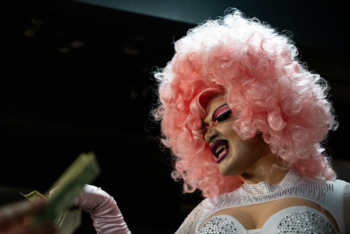 Vegina Quartz takes tips from the audience during her third performance of the night at the Funktastic Drag Show.