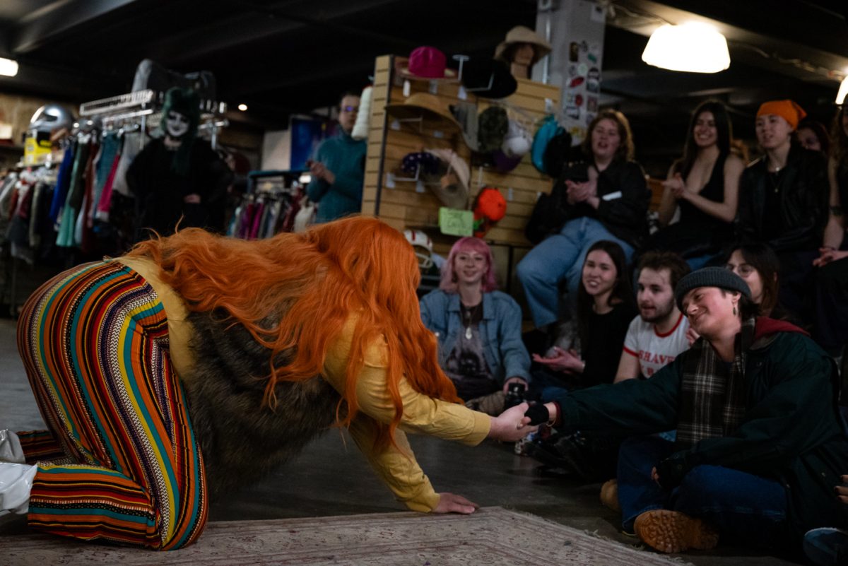 Liz Agna reaches for an audience member's hand during her performance at the Funktastic Drag Show.