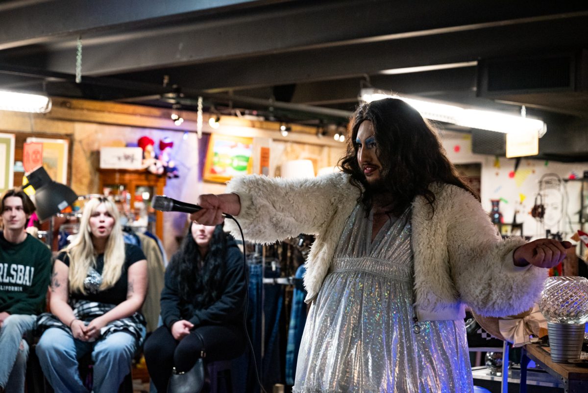 Liz Agna asks the audience to practice cheering before the Funktastic Drag Show.