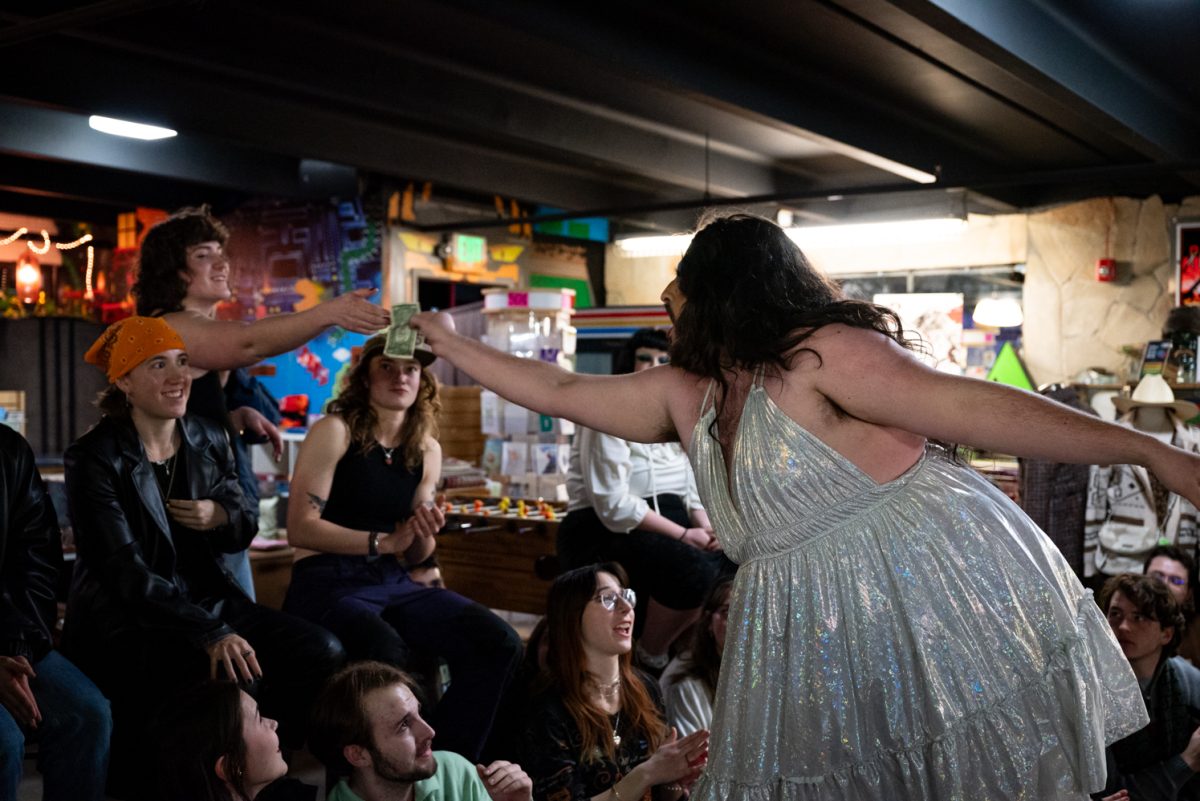 Liz Agna takes a dollar from an audience member during her opening performance at the Funktastic Drag Show.